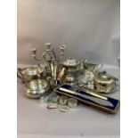 A collection of silver plated ware including a kettle with cane wrapped handle, glass preserve