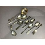 A Dutch silver souvenir spoon with figure finial, three foreign silver teaspoons and a child's