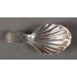 A GEORGE III SILVER CADDY SPOON WITH SHELL SHAPED BOWL, the stem engraved with an initialled oval