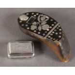 AN 18TH CENTURY HORN AND SILVER INLAID SNUFF BOX, the hinged cover inlaid with the emblems of the