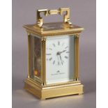 A MODERN GILT BRASS CARRIAGE CLOCK BY MATTHEW NORMAN, Swiss eight day movement having a platform