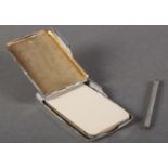 AN EDWARD VII SILVER ENGINE TURNED NOTE BOOK CASE with spring hinged cover with vacant circular