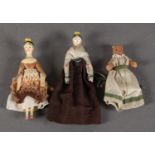 TWO 19TH CENTURY PAINTED WOODEN PEG DOLLS with painted heads and jointed limbs, approximate 10cm