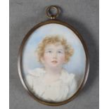 A PORTRAIT MINIATURE OF A YOUNG BOY with curly blonde hair, head and shoulders, on ivory, 7cm x 6cm,