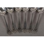 A SET OF SIX SILVER GRAPEFRUIT SPOONS with fret cut terminals, by Joseph Rodgers & Sons Ltd,