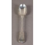A GEORGE V SILVER FIDDLE PATTERN BASTING SPOON, engraved with a crest, by Josiah Williams & Co,
