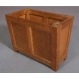 PETER HEAP OF WETWANG RABBIT MAN: Oak magazine rack of twin indented panel front and back, on
