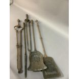 A quantity of Victorian steel fire irons, comprising two shovels, one poker and two tongs