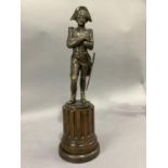 A reproduction bronzed metal figure of Napoleon raised on a fluted half column 46cm high