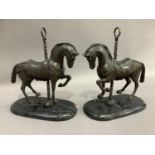 A pair of reproduction bronze effect merry-go-round horses on oval marble bases, overall 32cm