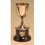 Hallmarked silver golfing trophy cup with crossed club design to front, on original black stand with