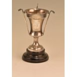 Hallmarked silver golfing trophy with undulated body with three golf club and balls to body,