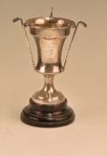 Hallmarked silver golfing trophy with undulated body with three golf club and balls to body,