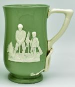 Spode Copeland Golfing Tankard: green tankard with white relief golfing figures and handle, height