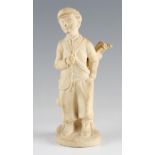 Early 20th century Ceramic Child Golfer Figure holding bag of clubs with unglazed finish, with