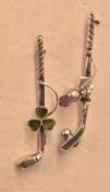 Two silver golf bar broaches, both having golf club with one having longnose with ball and purple