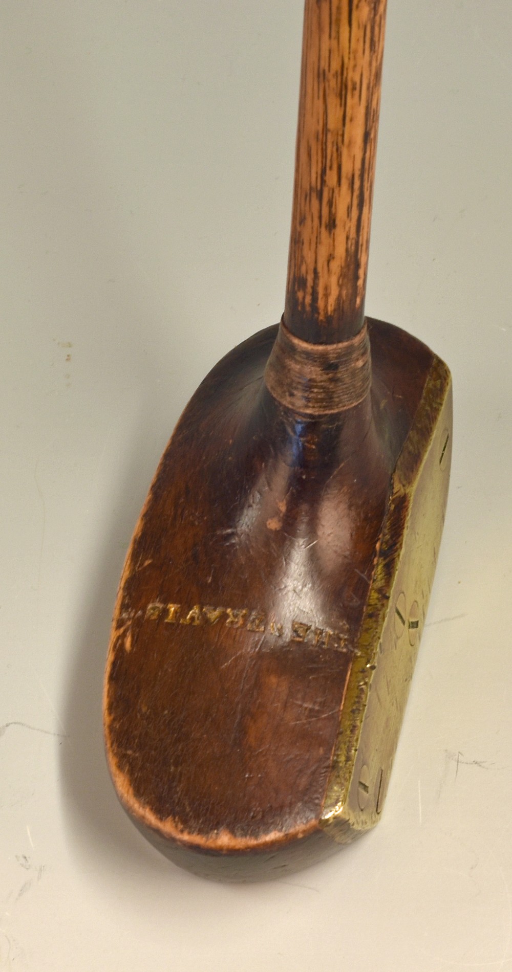 An early and original “The Travis” wooden mallet centre shaft putter – with full brass face plate,