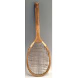 Early Slazengers ‘The Demon’ fishtail wooden tennis racket with a convex wedge, shoulder straps,