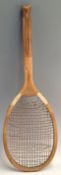 Early Slazengers ‘The Demon’ fishtail wooden tennis racket with a convex wedge, shoulder straps,