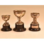 Group of 3x hallmarked silver golfing cups with stands each having crossed club designs, two