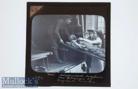WWI Original Glass slide showing a wounded Sikh soldier taken to an ambulance on a stretcher by a