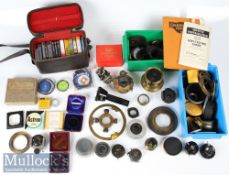 Quantity of camera lenses, lens hood, filters and accessories including Eastman Kodak shutter,