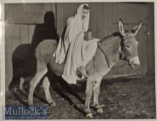 Ruth Woolsey as MK Gandhi riding a Donkey Press Photograph with notes and stamp to reverse, date 8-