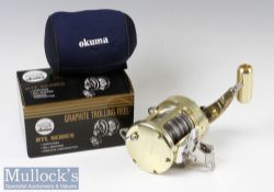 Okuma Titus TG 30 II graphite trolling reel in gold finish with lever drag, marked T2106 with
