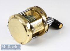 Penn 30 International big game multiplier reel finished in gold and chrome, with power handle,