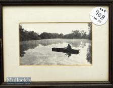 Black and white photograph of Chris Yates fishing from a punt in Remire taken from the Mediah