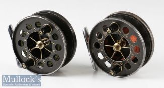 2x Allcocks Aerial 3 ¾” centre pin reels in black finishes, six spoke, perforated faces, chrome feet