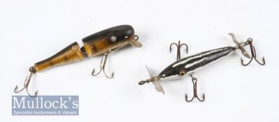 Early glass eye propeller plug bait in Heddon style together with a Paw Paw J C Higgins joined