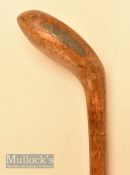 Generous sized light stained wooden driver head style golf walking stick with bullseye central fibre