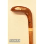 An attractive small wooden head driver shaped golf walking stick with rounded sole, brown fibre