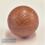 Unusual brown guttie style mesh pattern golf ball in hard rubber