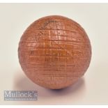 Unusual brown guttie style mesh pattern golf ball in hard rubber