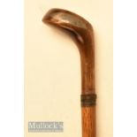 An elegant small wooden driver head golf walking stick with black triangular face insert with wooden