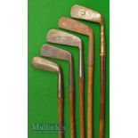 5x Various putters including Wright & Ditson US straight blade; a putting cleek showing the Rifle