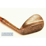 Fine Gibson of Kinghorn ‘Skoogee’ wide soled concave faced niblick fitted with a full length grip,