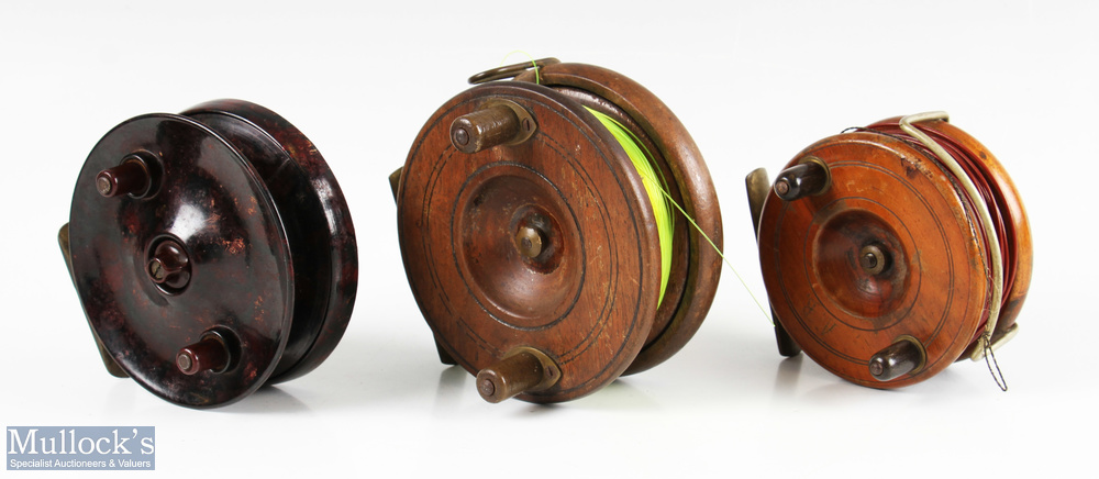 2x Nottingham wood and brass reels to include a 4 ¼” reel with brass strapback, a 3 ½” wood and