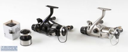 Shimano GTE 5000 and 5000B baitrunner spinning reels and spare spools black and silver examples both