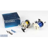 Mitchell 600 multiplier salt water reel with white end plates and chrome construction, with rod