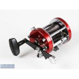 ABU Ambassadeur 7000 multiplier reel stamped 821000 to base, finished in red, runs smooth, signs
