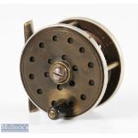 Jardine Heatons Patent 2 ½” ebonite and brass fly reel with ventilated face, rear and spool,