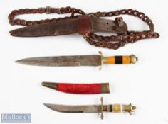 Two Sikh Indian Dress Kirpan Knives one having wooden and amber coloured banded handle with brass