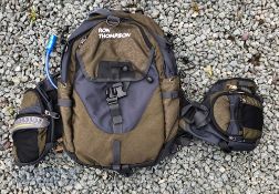 Ron Thompson Hydration Backpack Bag with water bladder compartment for drinking, with several zip