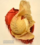 100% No. 3 square mesh red cellophane paper wrapped golf ball – partially unwrapped c/w details of