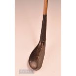 Interesting and unusual T Morris dark stained beech wood curved face short spoon with full brass