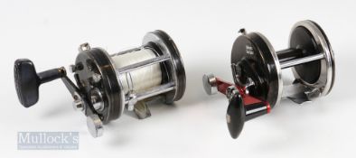 2x Abu Ambassadeur Multiplier Reels – 9000C with red handle having slight bend and 7000C with line