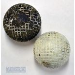 2x guttie moulded square mesh pattern golf balls - one repainted white and the other large used